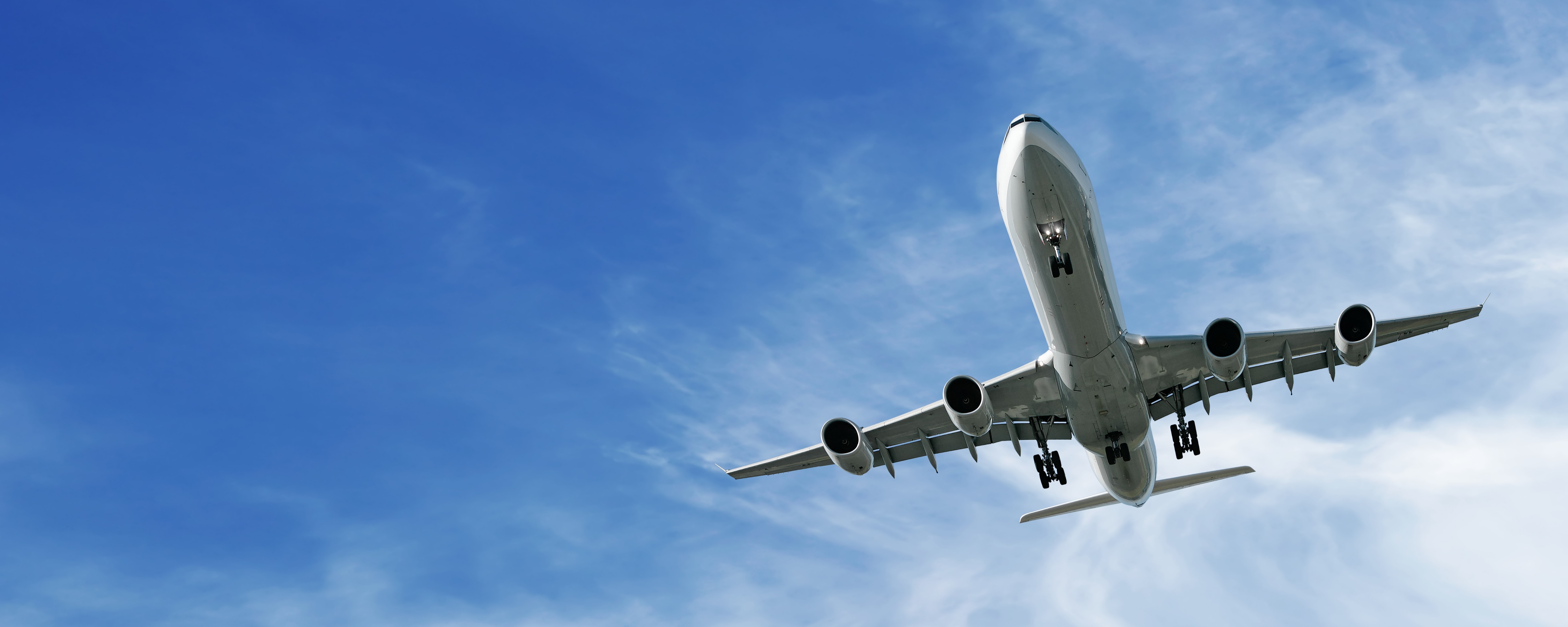Cargo airplane flying over ocean